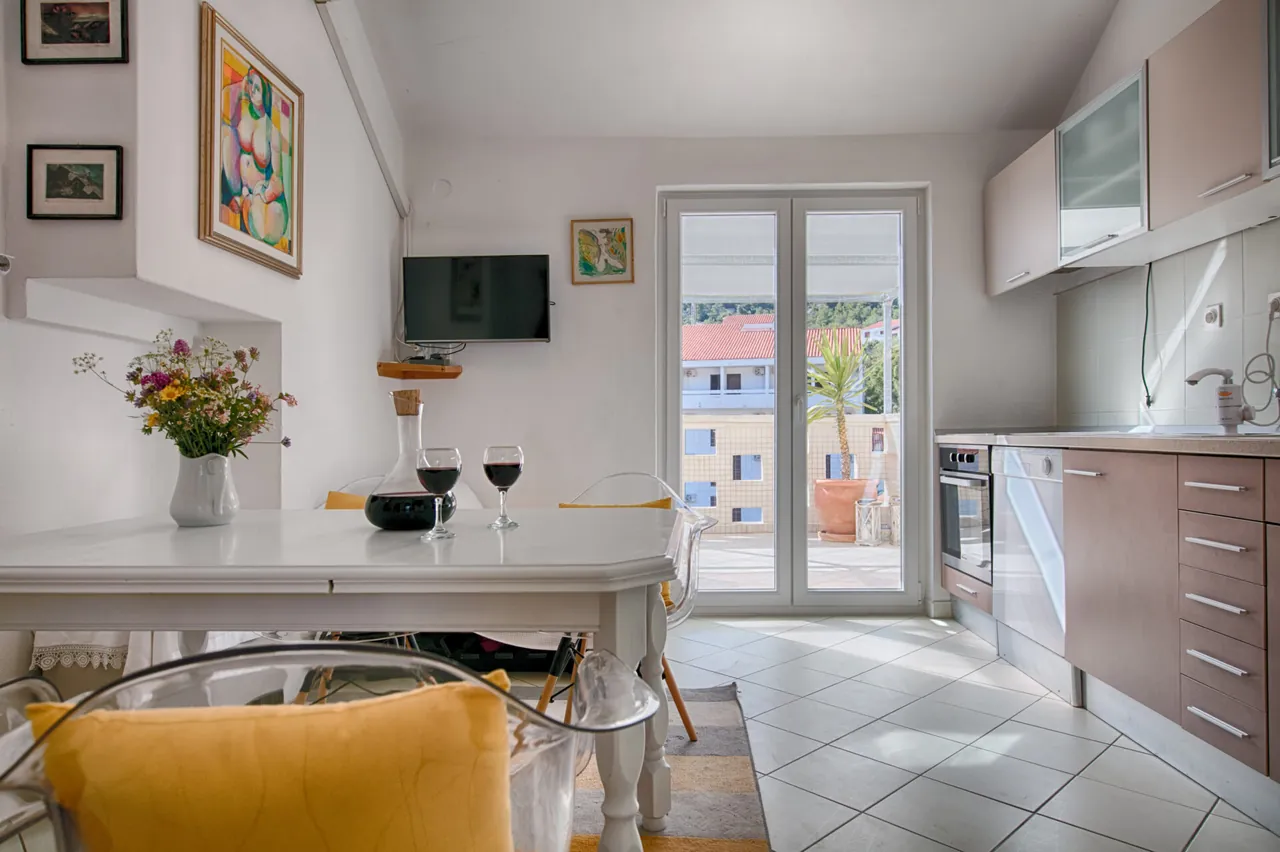 Dining table and glass doors, Nono Andre apartment, Komiža